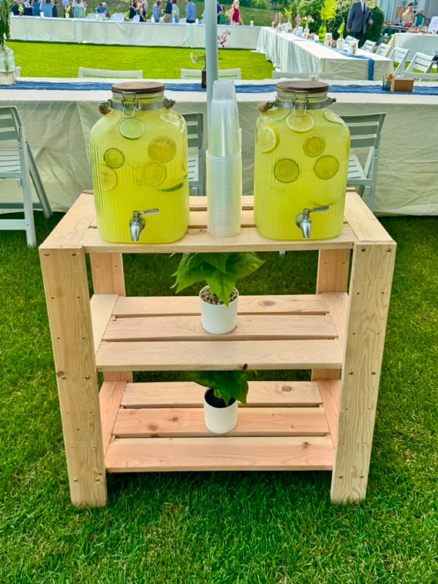 Rustic beverage station with lemonade dispensers and fresh citrus