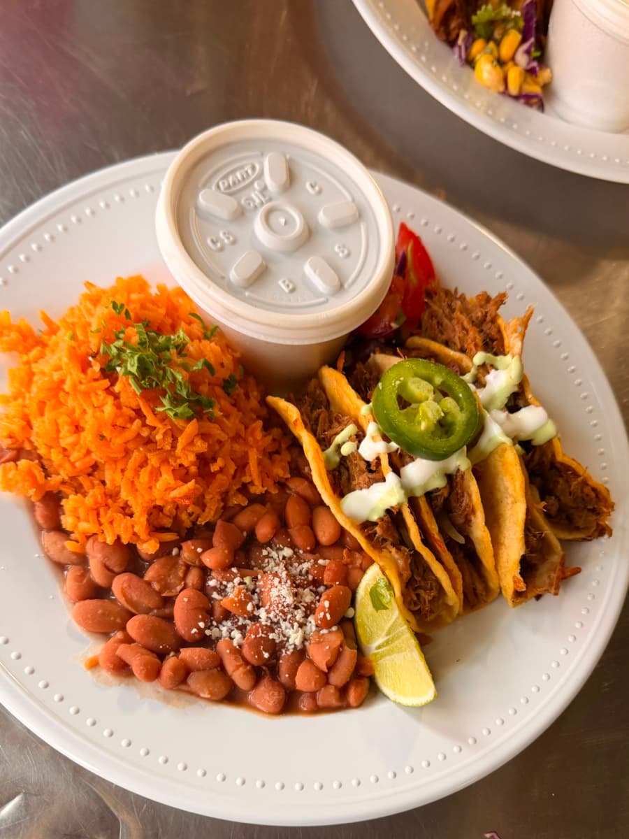 Formal plated taco banquet with ceramic china, fresh lime, rice and beans